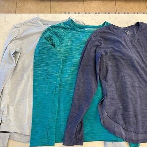 Lot of 3 long sleeve athletic shirts in girls L